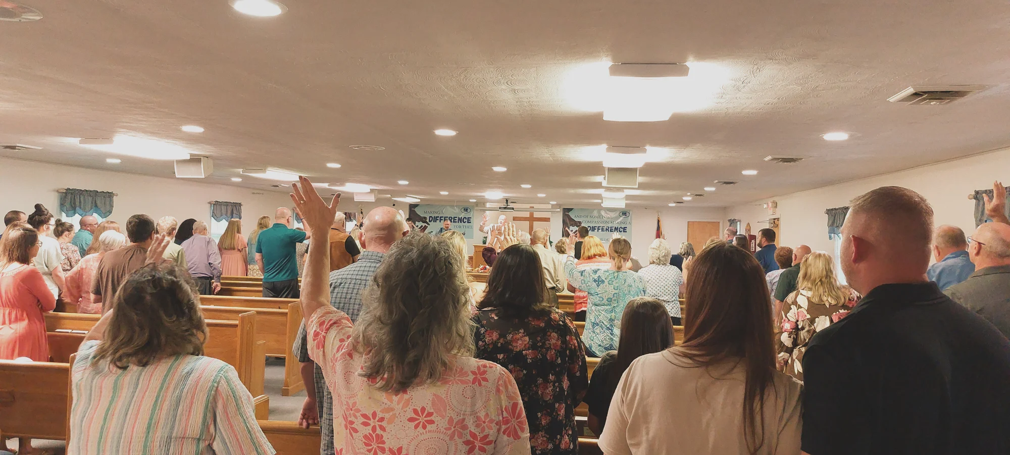 The Open Door Baptist Church congregation worshipping together